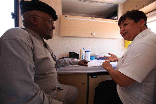 Archbishop Desmond Tutu gets an HIV test on The Desmond Tutu HIV Foundation's Tutu Tester, a mobile test unit that brings healthcare right to your doorstep. Photo: Wikimedia