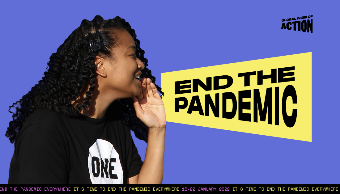 A ONE activist makes a megaphone with their hand to amplify the message to end the pandemic everywhere