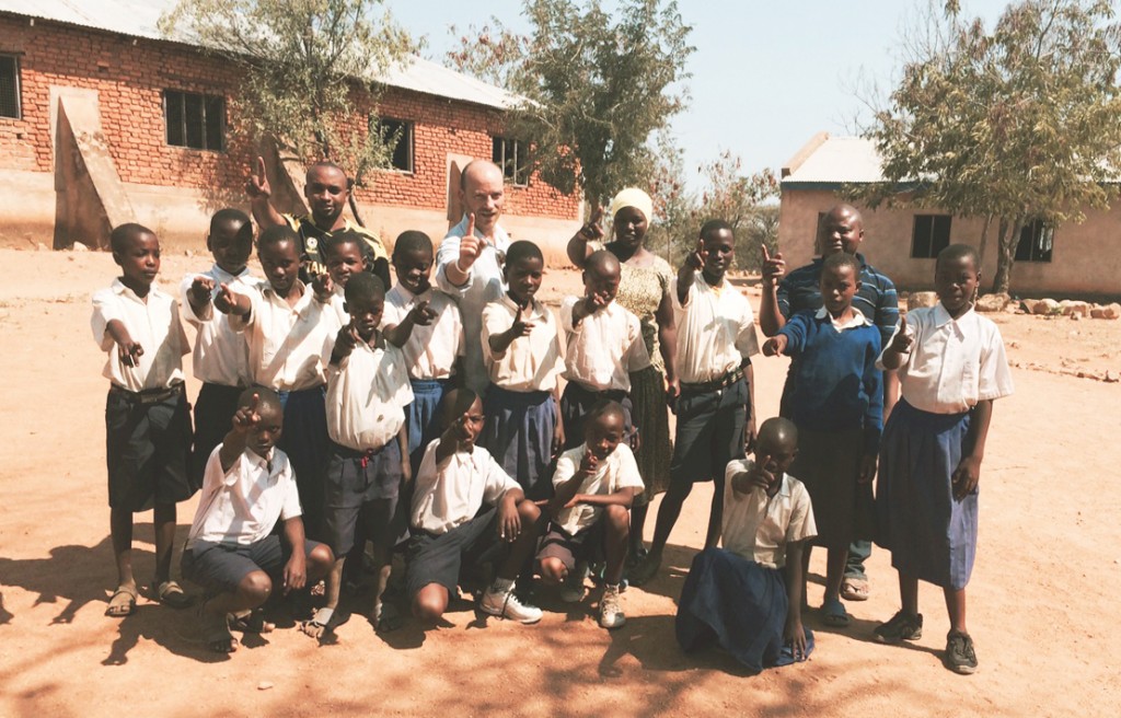 ONE co-founder Jamie Drummond with pupils at school who will be 15 in 2015. Photo: ONE