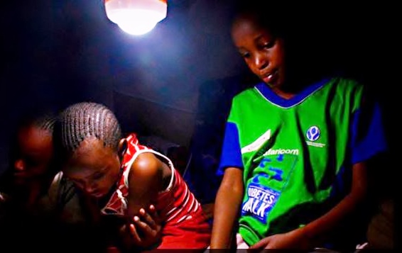 Solar lamps change the lives of students by giving them more time to read. Photo credit: Skynotch Africa