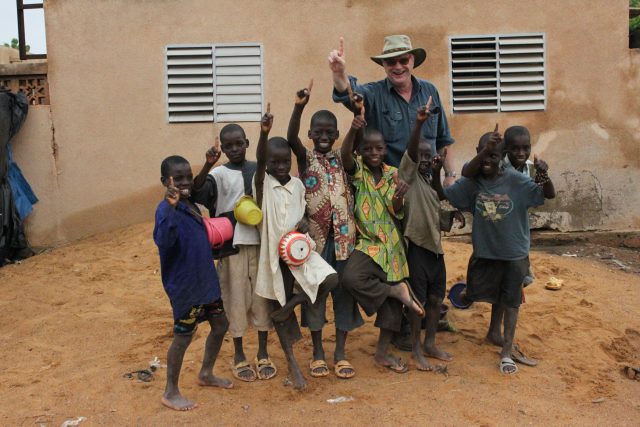 Michael Elliott with a group of children during a trip to Segou, Mali.