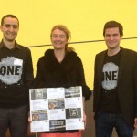 Sophie Auconie, French MEP from the Centre Right party, receiving a sample of postcards by French ONE members
