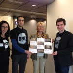 Véronique Mathieu Houillon, French MEP from the Centre Right party, receiving a sample of postcards from Arnaud Stuart and Mohez Ellala, French ONE members, and Friederike Röder, ONE France Director.