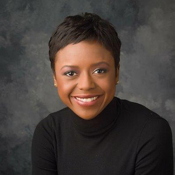 head shot of Mellody Hobson against a dark grey background