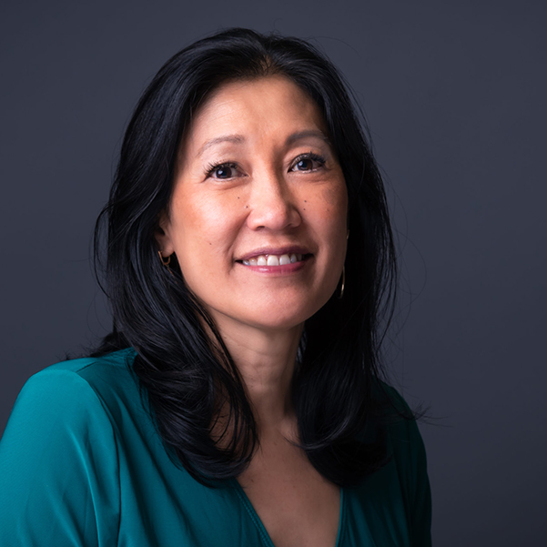 headshot of Theresia Gouw against a dark grey background