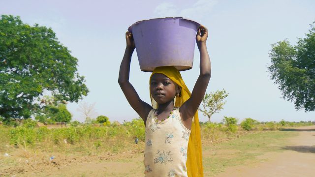 This young girl spends much of her day fetching water for her family. Many times, the responsibility of maintaining the family's water supply falls on daughters. 